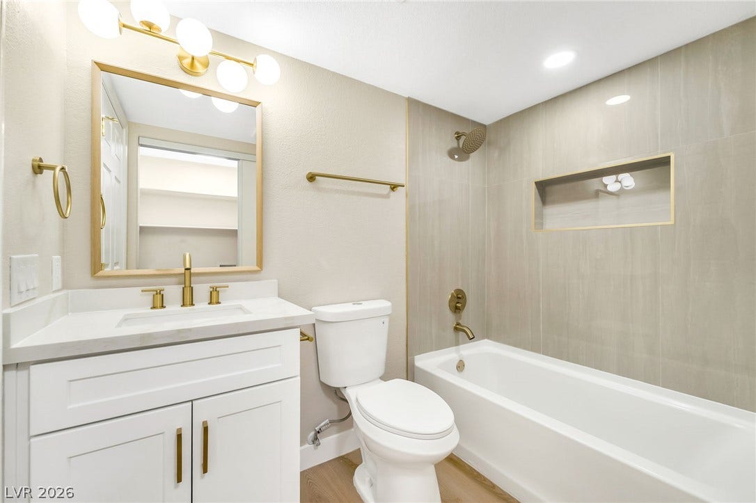 601 Cabrillo Circle, #431, Henderson, NV 89015 Gleaming gold fixtures and modern tiling elevate this beautifully updated full bathroom.