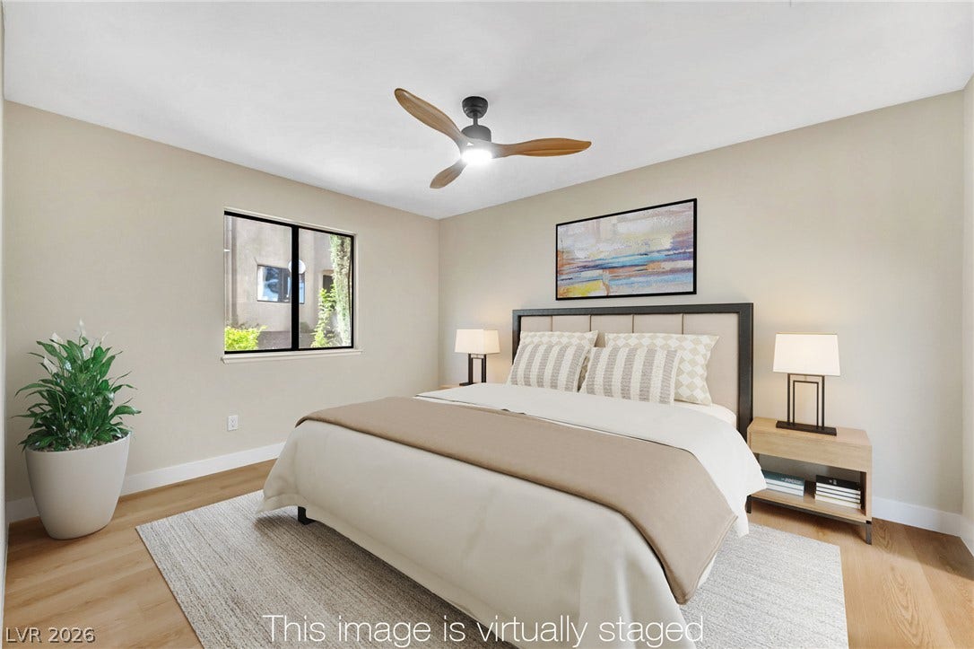601 Cabrillo Circle, #431, Henderson, NV 89015 Warm wood floors and a wide window anchor this comfortable sleeping space.