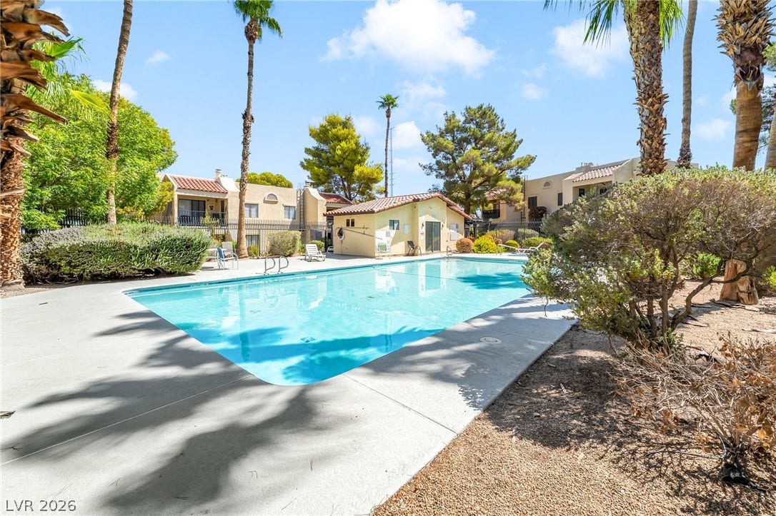 601 Cabrillo Circle, #431, Henderson, NV 89015 A sparkling community swimming pool serves as a central feature, bordered by a concrete deck.