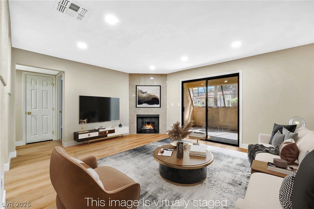 601 Cabrillo Circle, #431, Henderson, NV 89015 Gleaming hardwood floors and a corner fireplace anchor this inviting living space.