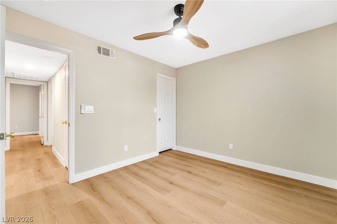601 Cabrillo Circle, #431, Henderson, NV 89015 Warm wood flooring and clean lines define this inviting bedroom space.