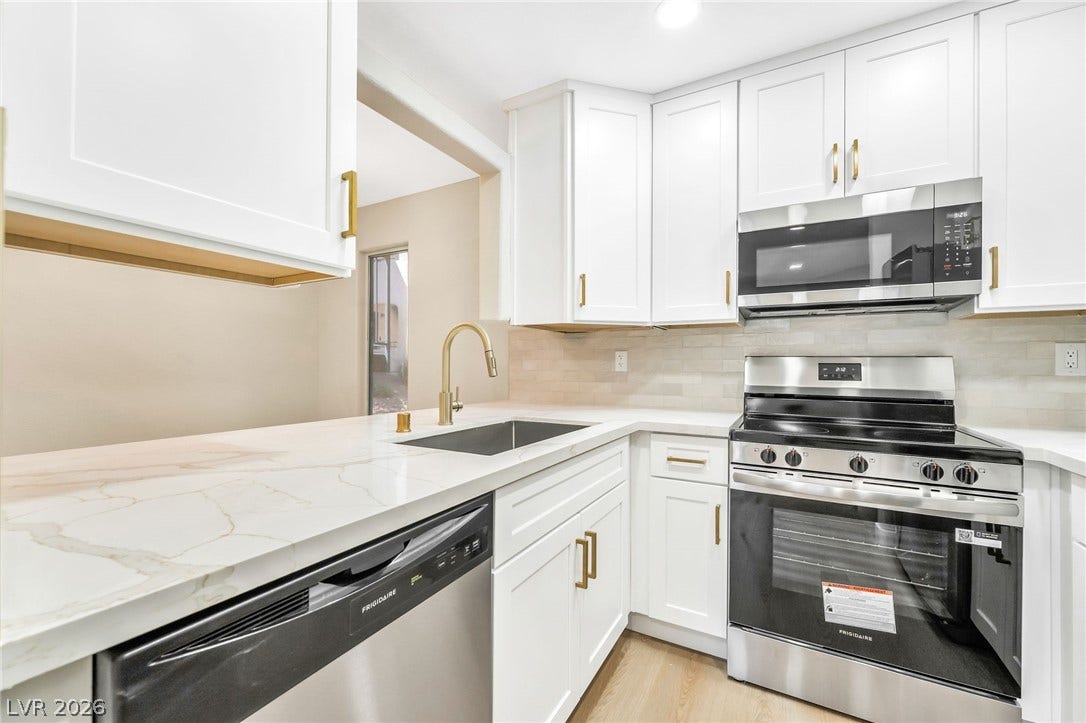 601 Cabrillo Circle, #431, Henderson, NV 89015 Shaker-style cabinetry and stone counters define this modern workspace.
