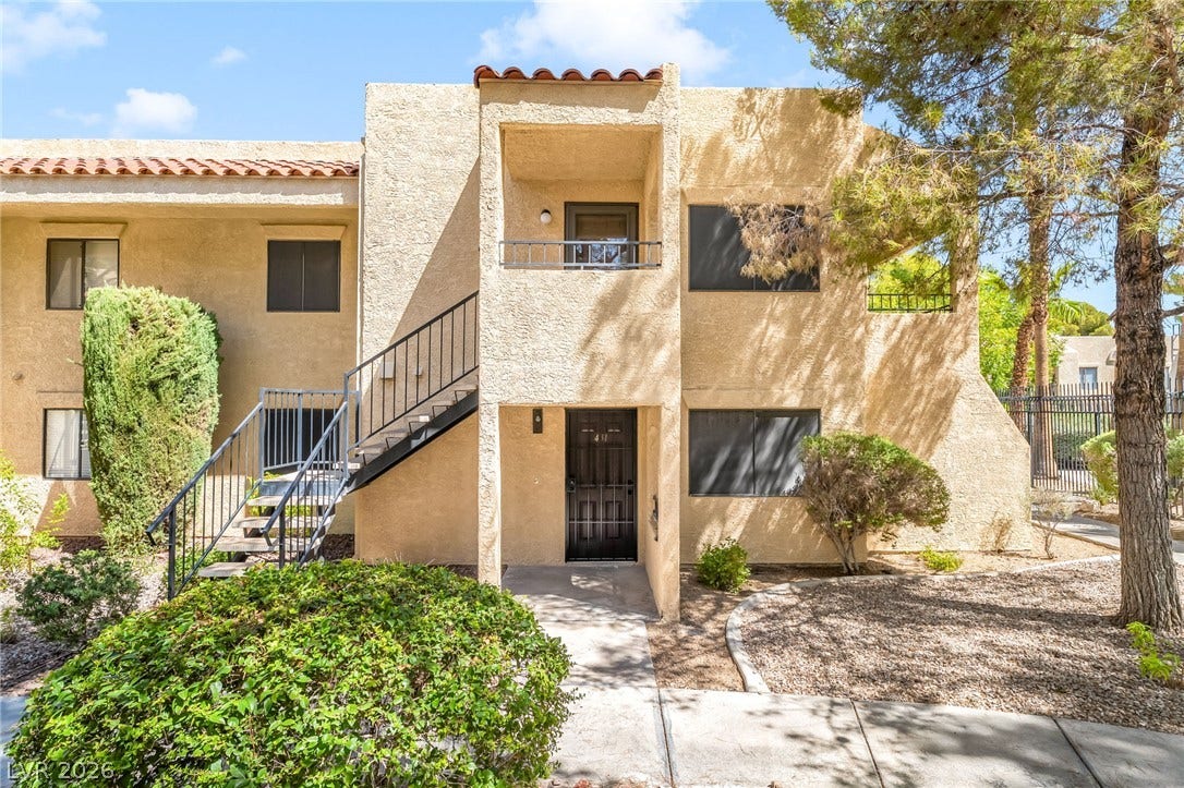 601 Cabrillo Circle, #431, Henderson, NV 89015 Stucco exterior finishes and Spanish tile roof accents define this multi-level residential building.