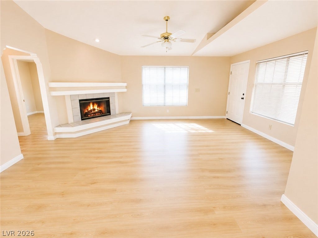 1417 Santa Margarita Street, #G, Las Vegas, NV 89146 A corner fireplace adds architectural detail to this light-filled room with new flooring.