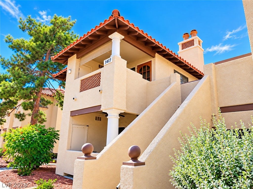 1417 Santa Margarita Street, #G, Las Vegas, NV 89146 Stucco exterior elements and a classic tile roof define this multi-level architectural entry.
