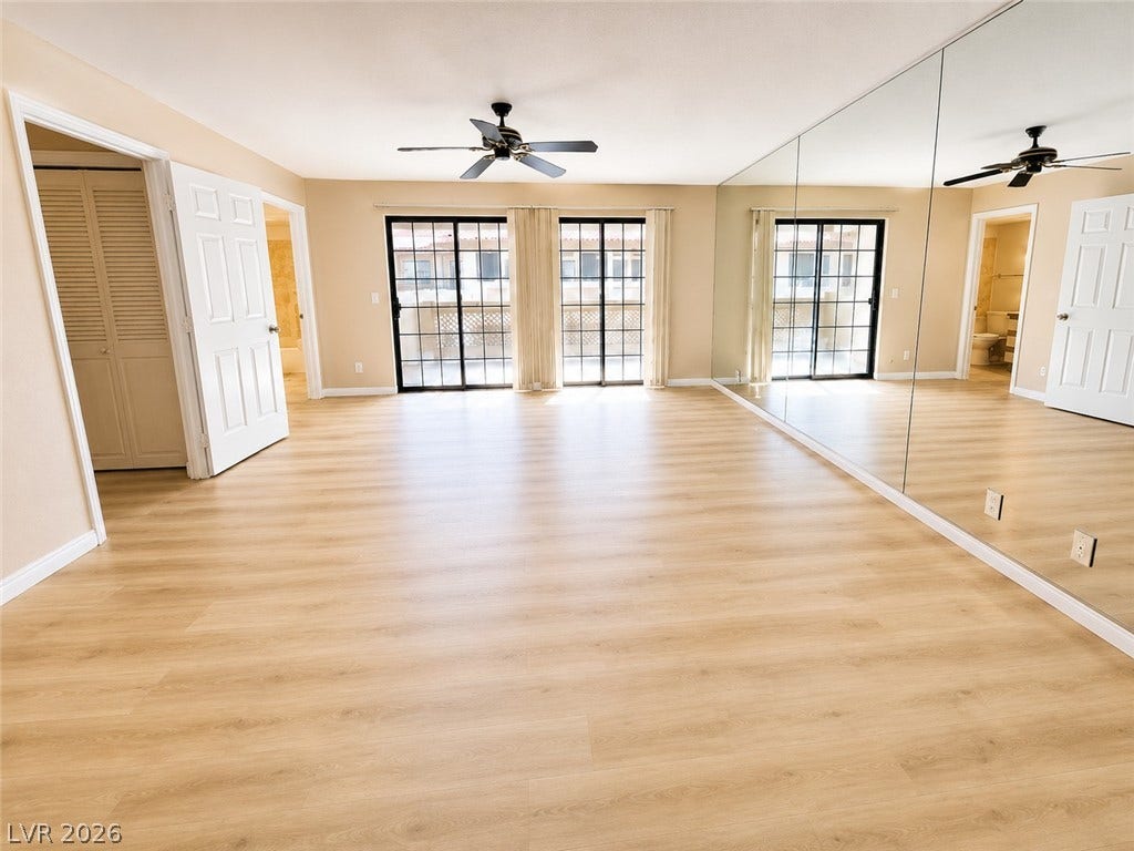 1417 Santa Margarita Street, #G, Las Vegas, NV 89146 new vinyl flooring and floor-to-ceiling mirrored walls , fresh paint elevate this versatile living space.