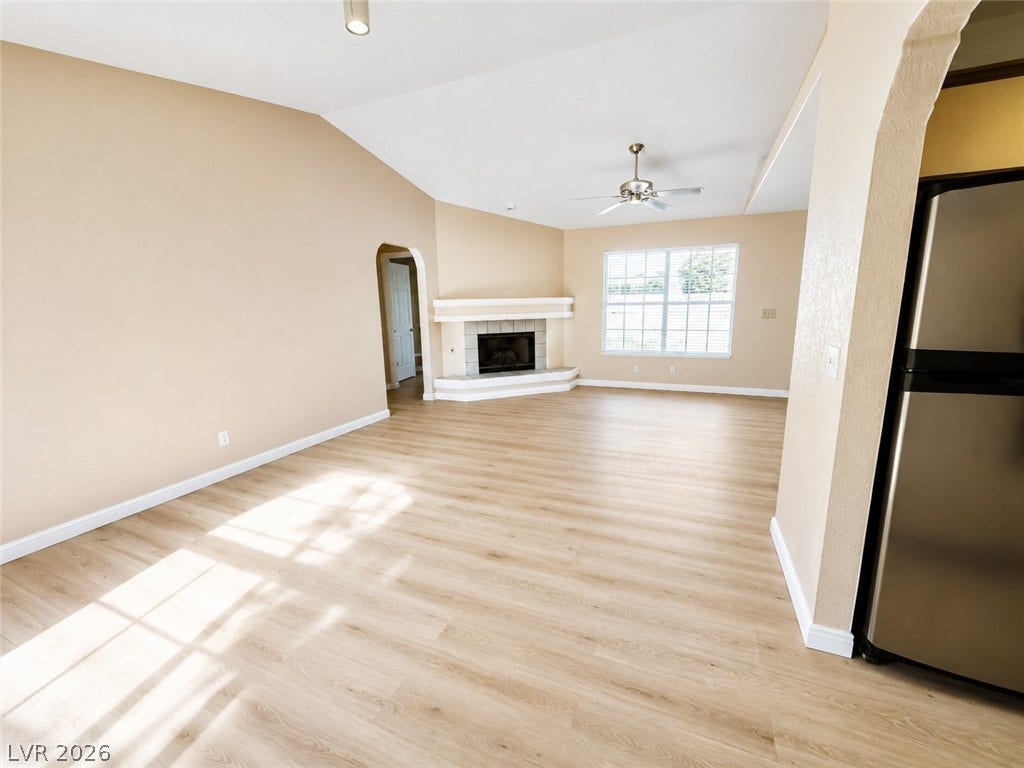1417 Santa Margarita Street, #G, Las Vegas, NV 89146 New Warm vinyl flooring and a cozy corner fireplace define this open living space.