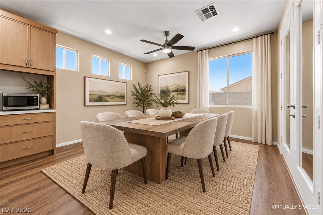 9613 Cherry Canyon Avenue, Las Vegas, NV 89129 Rich wood flooring pairs beautifully with custom built-ins under high ceilings in this refined space.