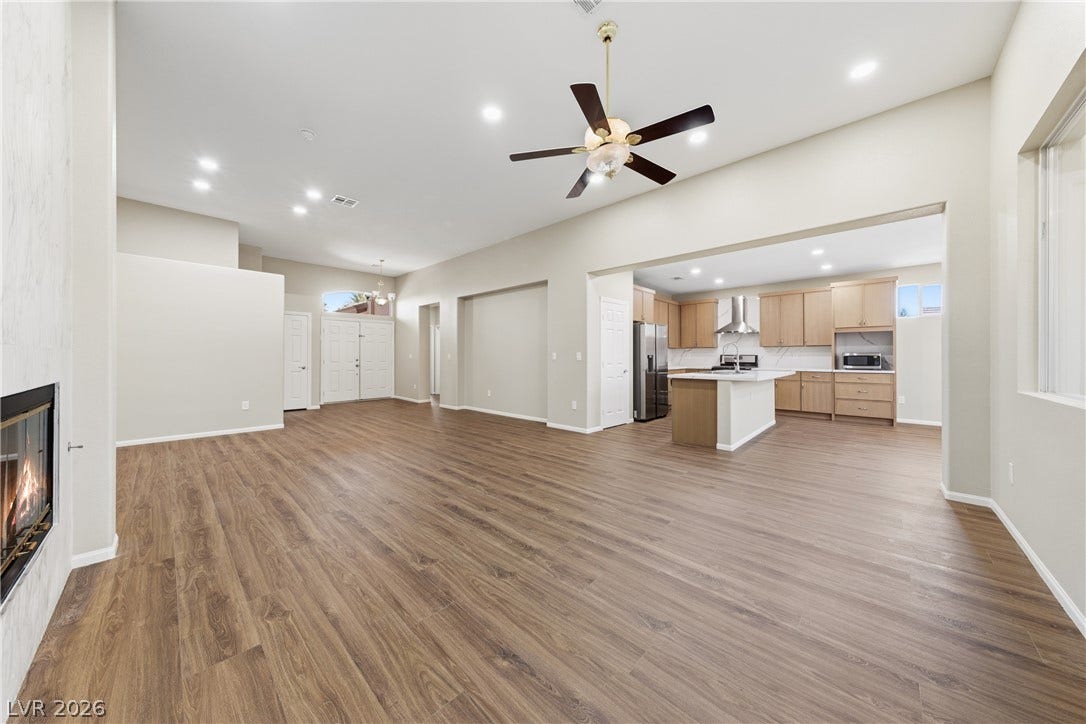 9613 Cherry Canyon Avenue, Las Vegas, NV 89129 Gleaming wood-look floors unite the spacious main living areas under soaring recessed ceilings.