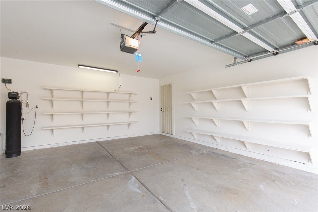 352 Lander Drive, Henderson, NV 89074 Ample built-in shelving and durable concrete flooring maximize organization in this garage space.