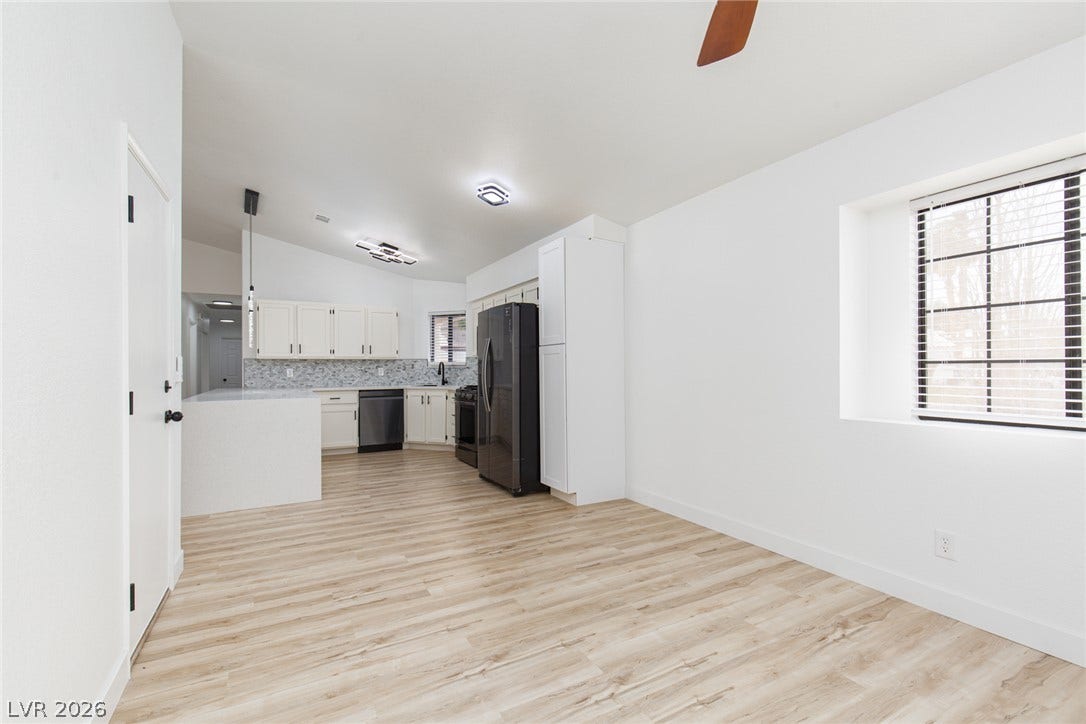 352 Lander Drive, Henderson, NV 89074 An open floorplan seamlessly connects the airy dining space to a modern kitchen.