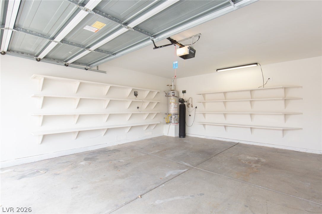352 Lander Drive, Henderson, NV 89074 Ample built-in shelving lines this functional garage space with a concrete floor.