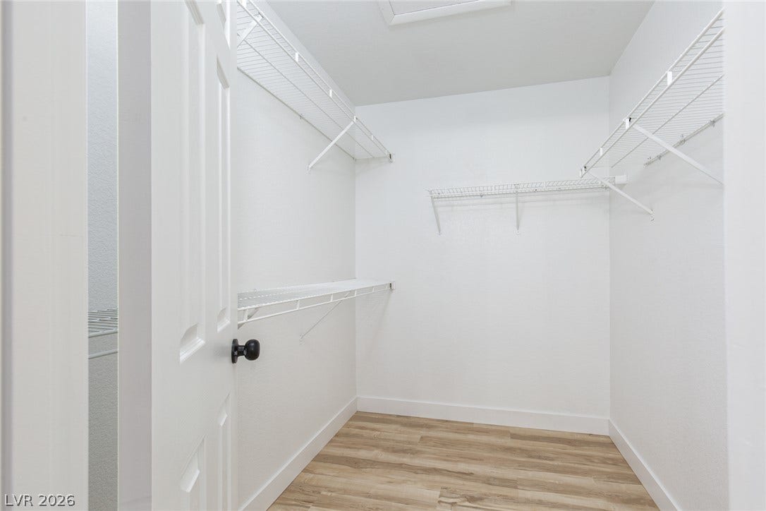 352 Lander Drive, Henderson, NV 89074 A spacious walk-in closet includes durable wire shelving and clean wood-look flooring.