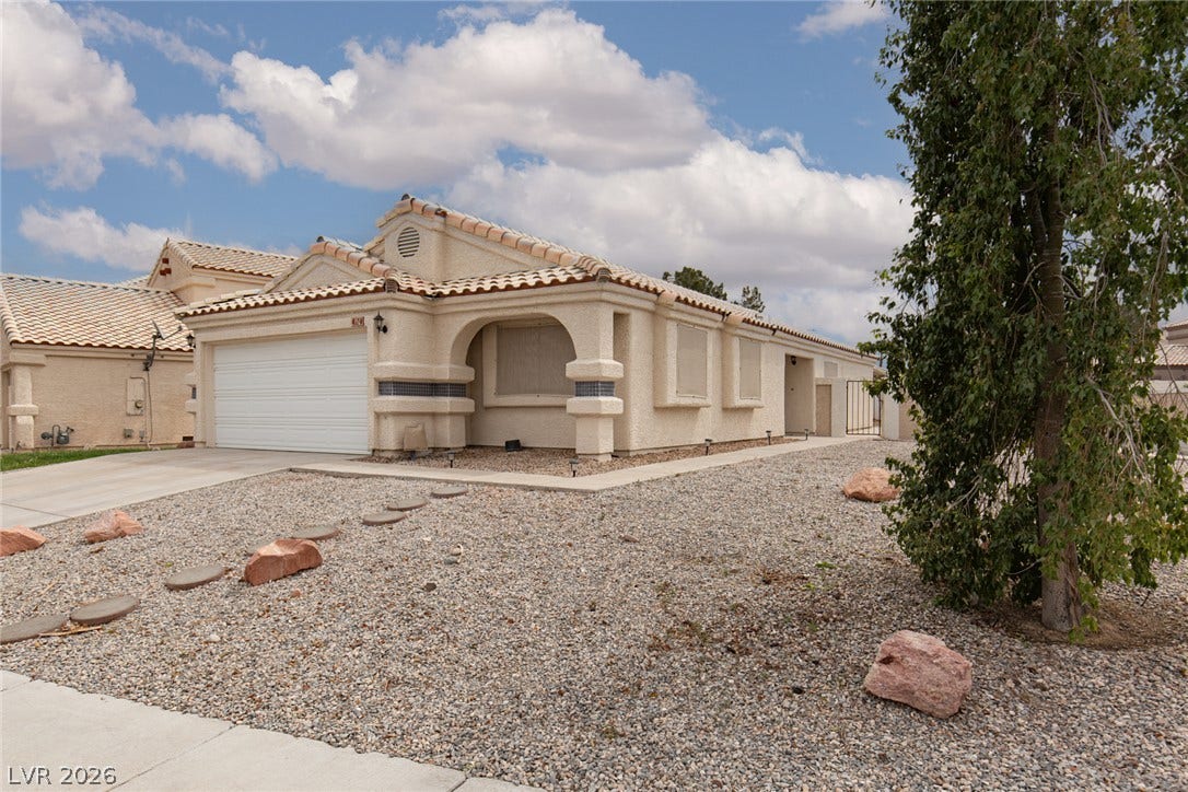 352 Lander Drive, Henderson, NV 89074 Classic tile roofing and stucco exterior walls define this southwestern style home.