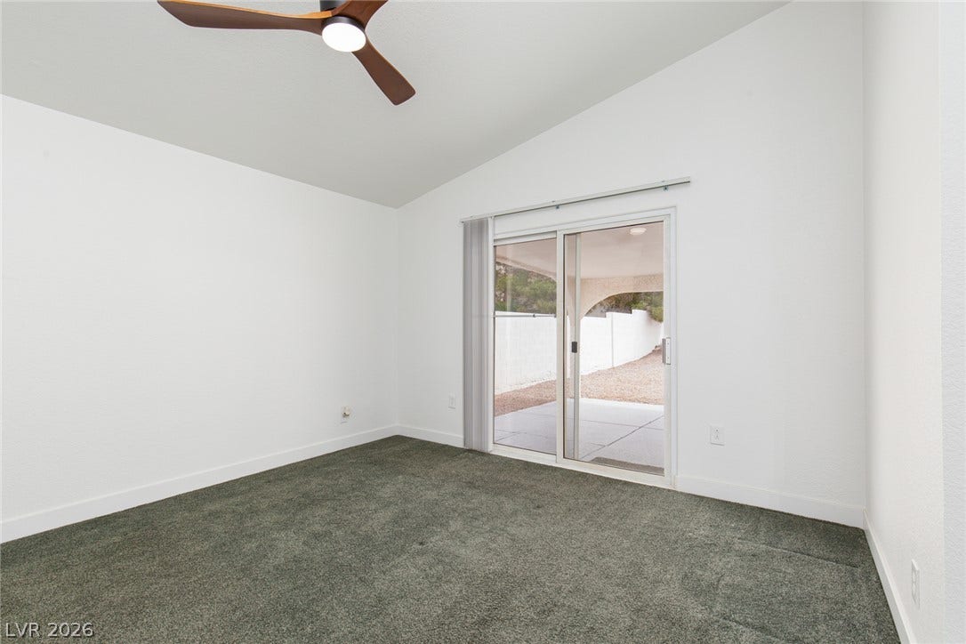 352 Lander Drive, Henderson, NV 89074 Vaulted ceilings and sliding glass doors create an inviting sense of space.