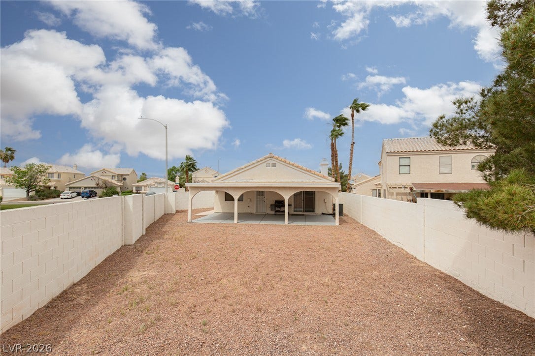 352 Lander Drive, Henderson, NV 89074 A low-maintenance yard features a covered patio framed by solid masonry walls.
