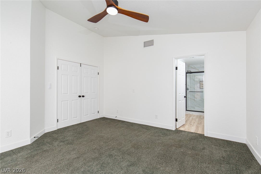 352 Lander Drive, Henderson, NV 89074 High ceilings and soft carpeting create a comfortable atmosphere with seamless access to the bath.