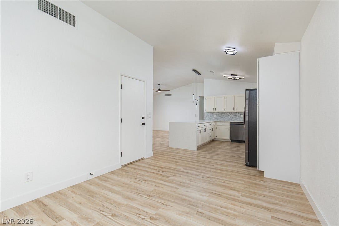 352 Lander Drive, Henderson, NV 89074 Clean lines and light flooring anchor the seamless transition between living and dining areas.