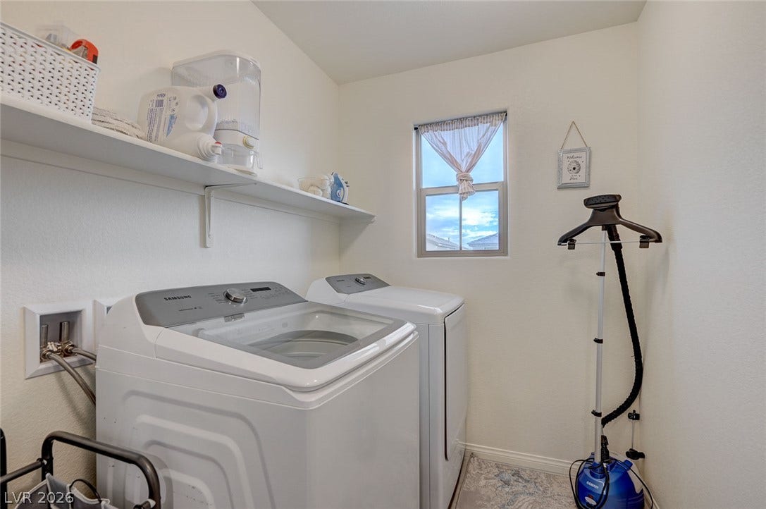 4114 Billowing Breeze Avenue, North Las Vegas, NV 89081 Functional laundry space includes convenient overhead shelving and a bright window.