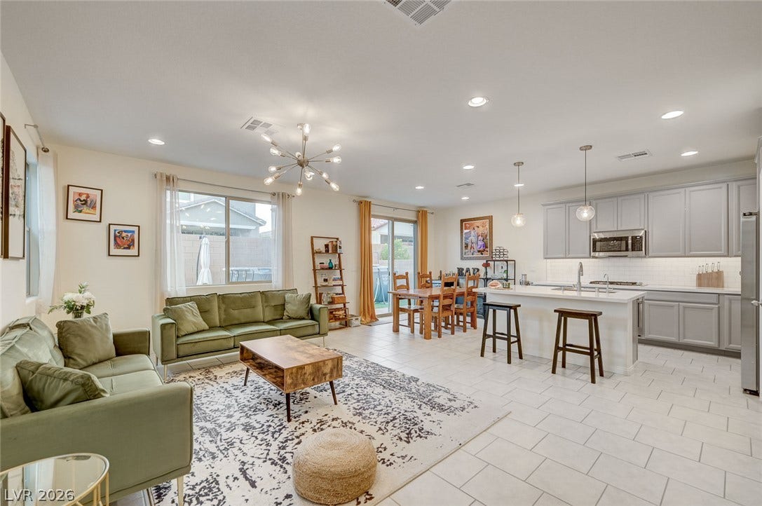 4114 Billowing Breeze Avenue, North Las Vegas, NV 89081 An open layout connects the comfortable living area directly to the kitchen and dining space.