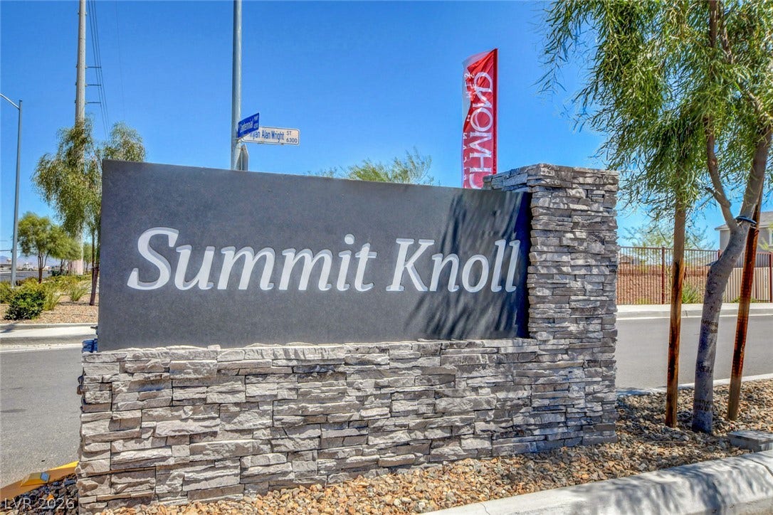 4114 Billowing Breeze Avenue, North Las Vegas, NV 89081 A prominent stone monument sign marks the entrance to the Summit Knoll community.