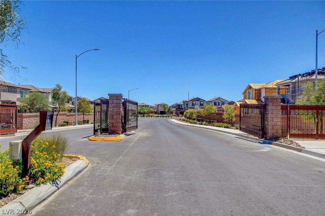 4114 Billowing Breeze Avenue, North Las Vegas, NV 89081 A secure gated entrance leads into this modern residential neighborhood.