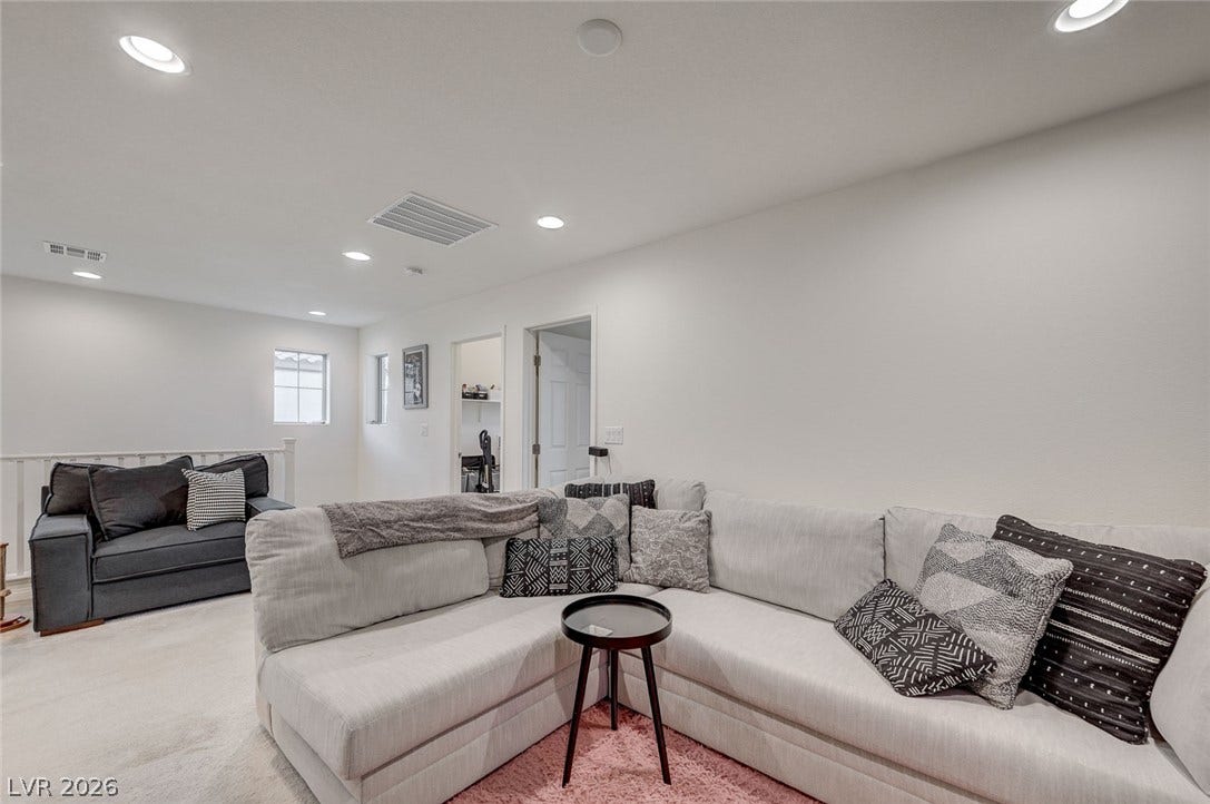 4114 Billowing Breeze Avenue, North Las Vegas, NV 89081 Recessed lighting and soft carpeting define this versatile upper-level common area.
