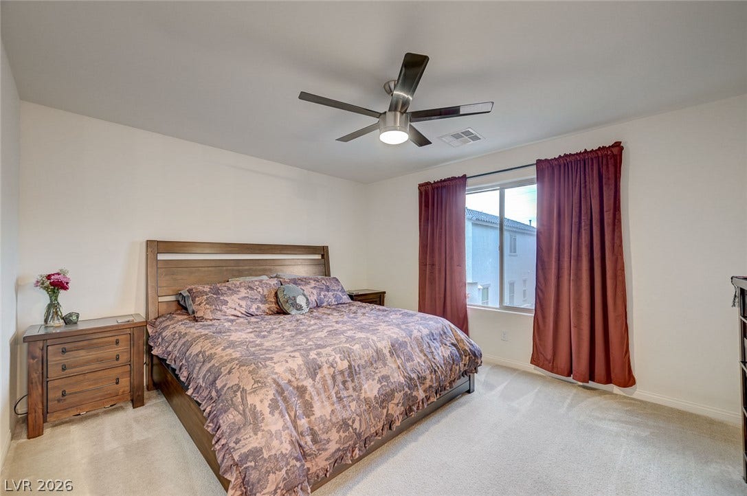 4114 Billowing Breeze Avenue, North Las Vegas, NV 89081 Soft carpeting underfoot and a large window create a comfortable, inviting retreat.