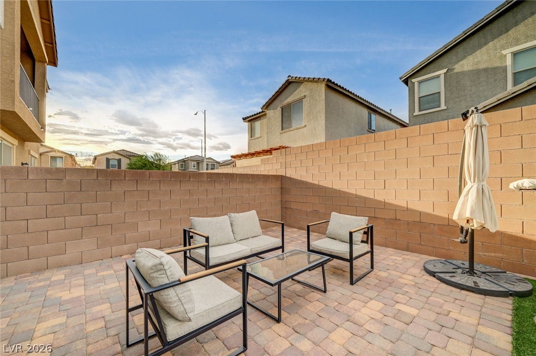 4114 Billowing Breeze Avenue, North Las Vegas, NV 89081 Block fencing encloses this private outdoor space paved with brick style stone pavers.