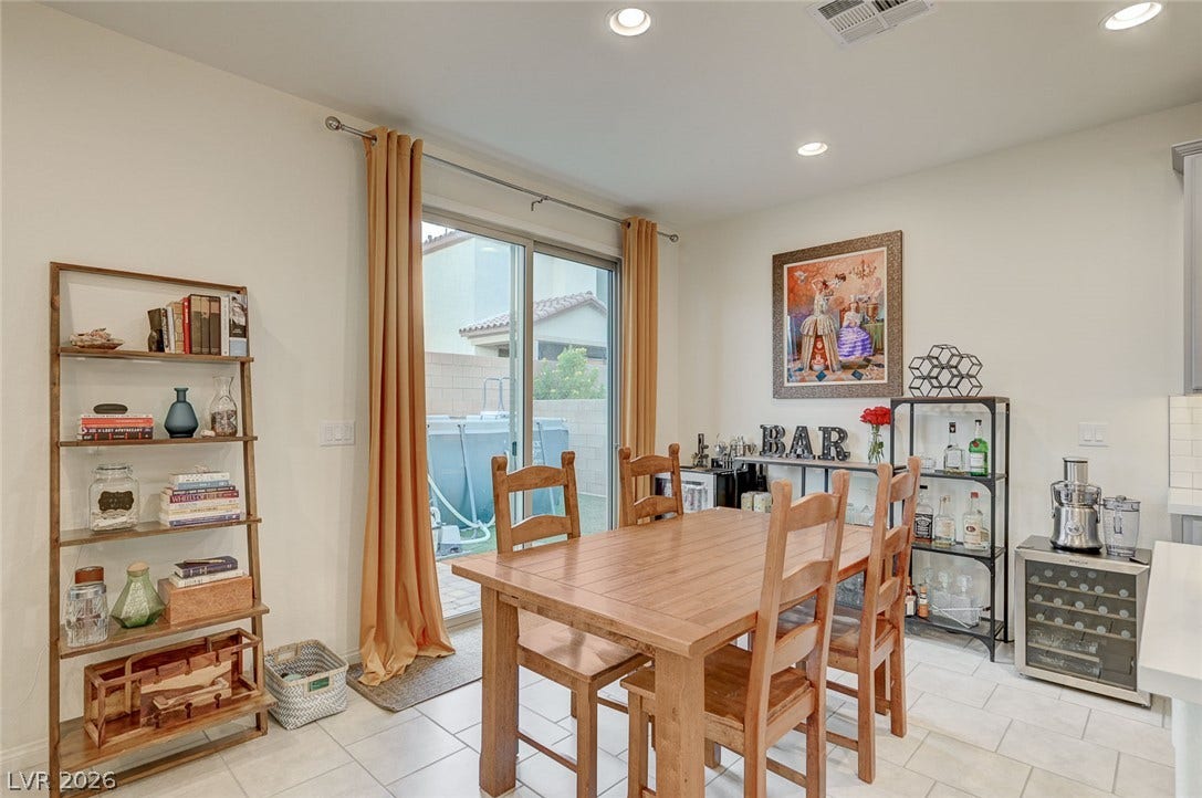 4114 Billowing Breeze Avenue, North Las Vegas, NV 89081 Sliding glass doors open to the outdoors from this inviting dining space with tile flooring.