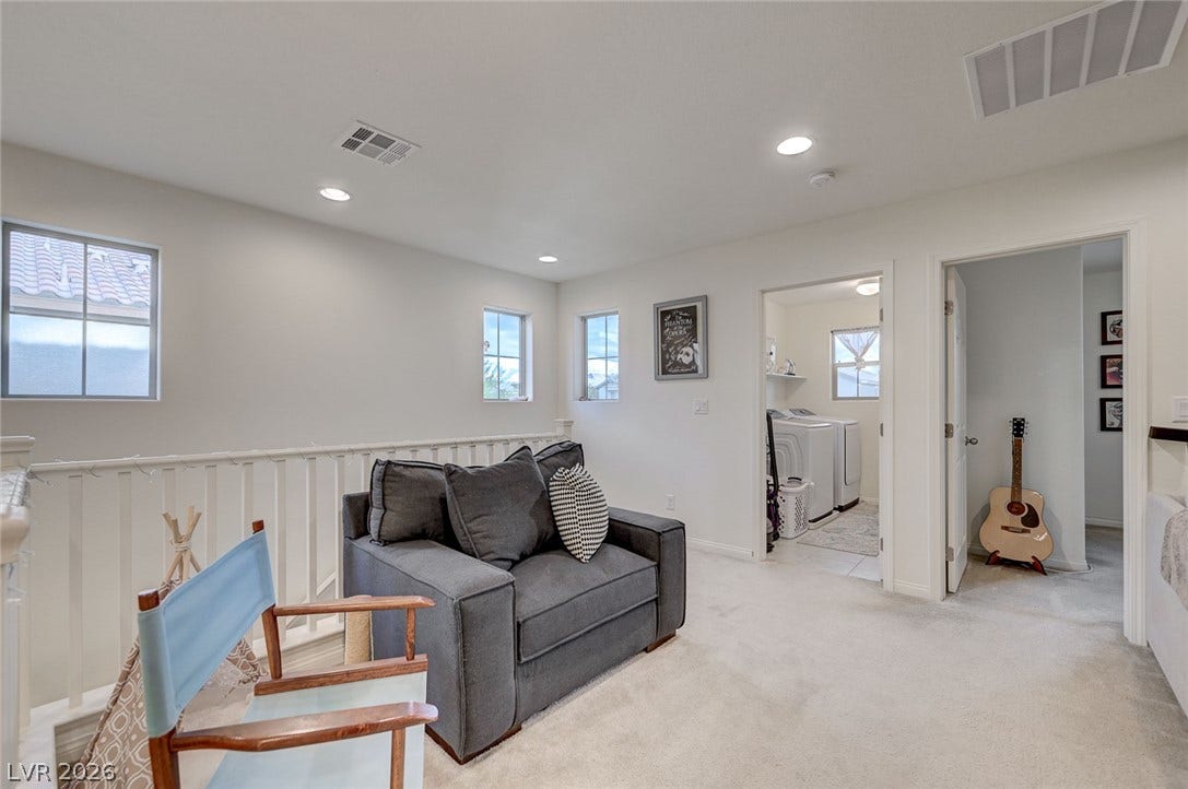 4114 Billowing Breeze Avenue, North Las Vegas, NV 89081 Plush carpeting and modern recessed lighting enhance this versatile upper-level bonus space.