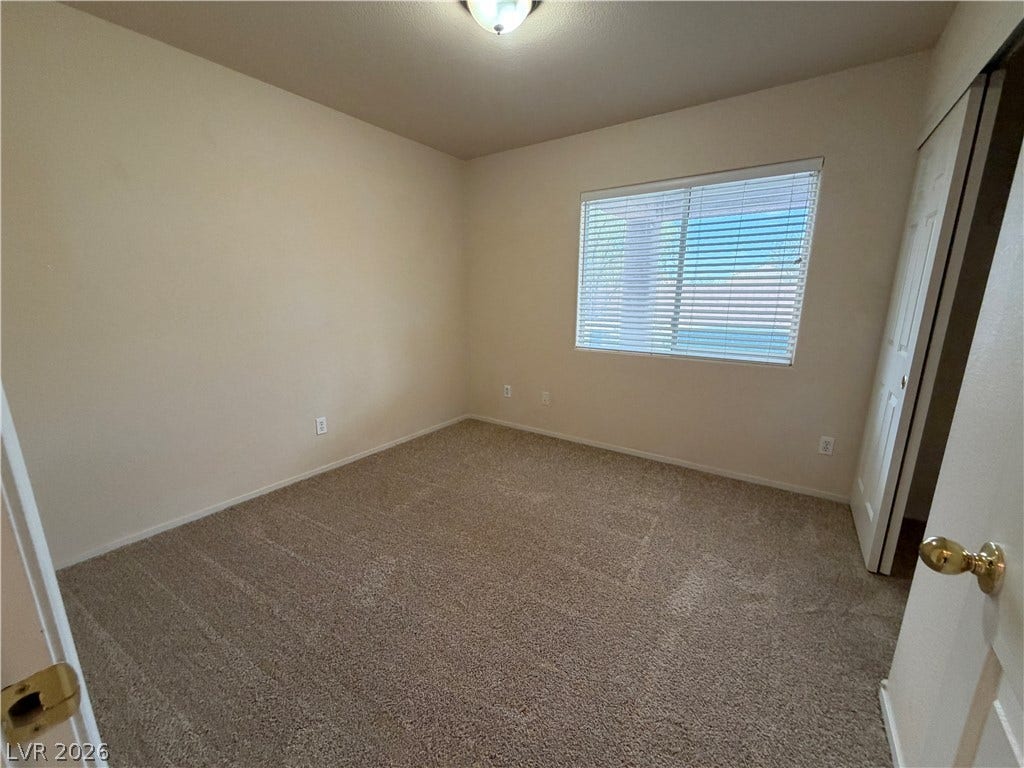 6420 W Casamar Street, North Las Vegas, NV 89086 Plush carpeting and natural light define this versatile secondary space.