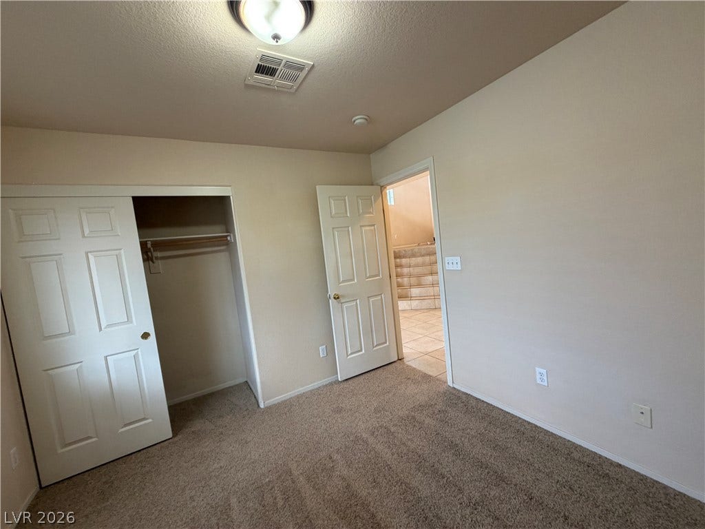6420 W Casamar Street, North Las Vegas, NV 89086 Soft carpeting underfoot anchors this quiet space featuring a built-in closet.