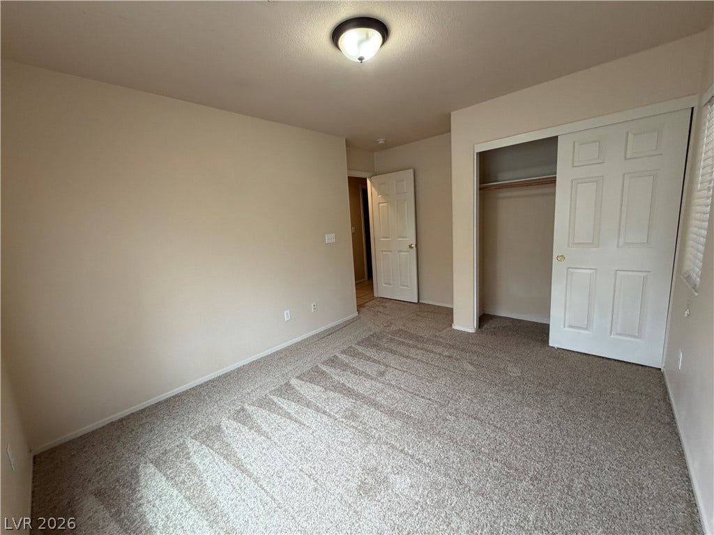 6420 W Casamar Street, North Las Vegas, NV 89086 Plush wall-to-wall carpeting and a spacious built-in closet define this versatile room.