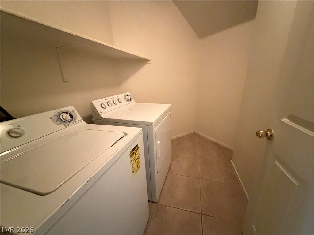 6420 W Casamar Street, North Las Vegas, NV 89086 Tiled flooring and built-in shelving maximize the utility of this dedicated laundry space.
