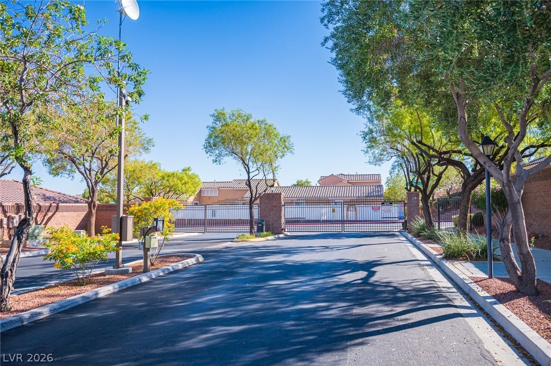 A secure gated entrance leads into this beautifully landscaped residential community.