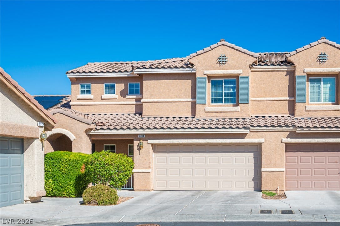 Spanish tile roofing and structured stucco detailing establish classic architectural appeal.