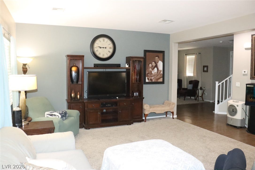An open floor plan connects the comfortable living space to the adjacent rooms.