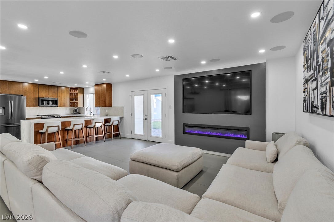 4170 Sheppard Drive, Las Vegas, NV 89121 An open layout integrates the main living space with a modern kitchen and dining area.