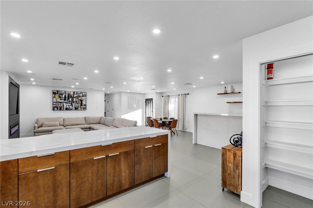 4170 Sheppard Drive, Las Vegas, NV 89121 An open floorplan seamlessly connects the kitchen island to the living and dining areas.