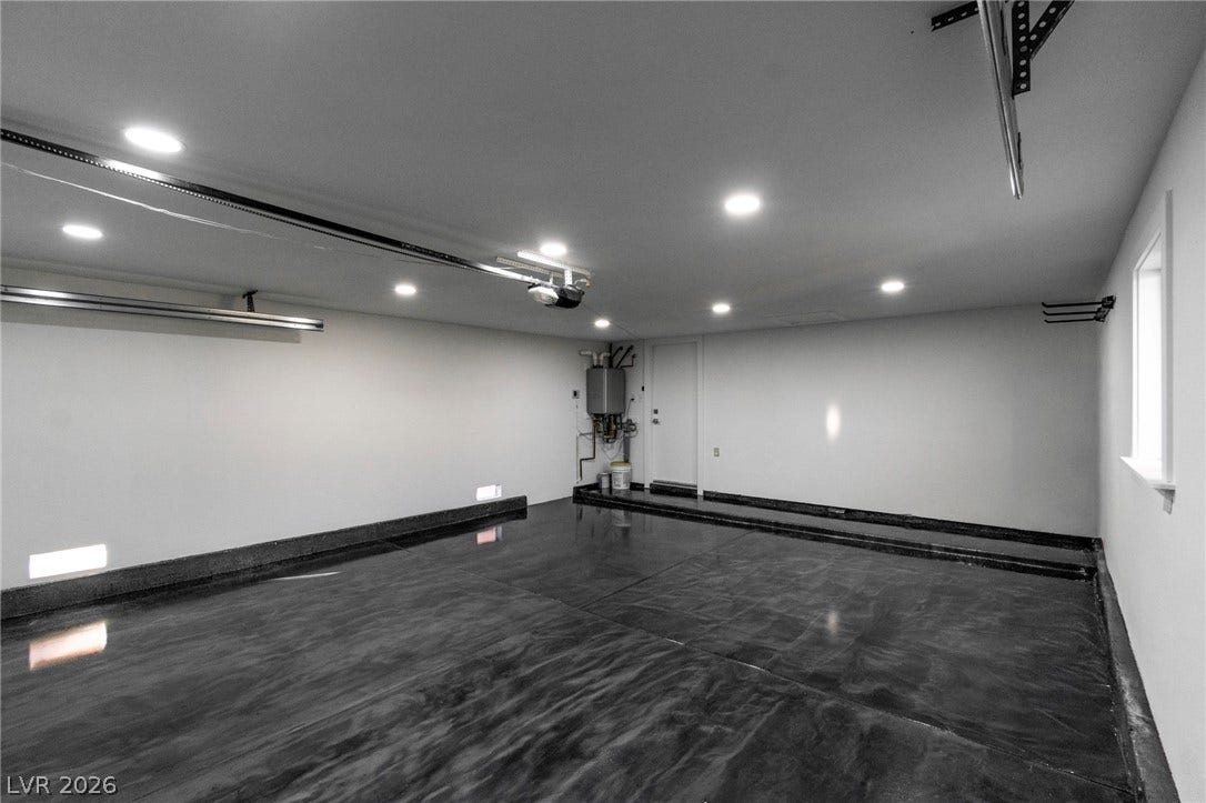 4170 Sheppard Drive, Las Vegas, NV 89121 Polished concrete floors and recessed lighting define this pristine multi-vehicle storage space.