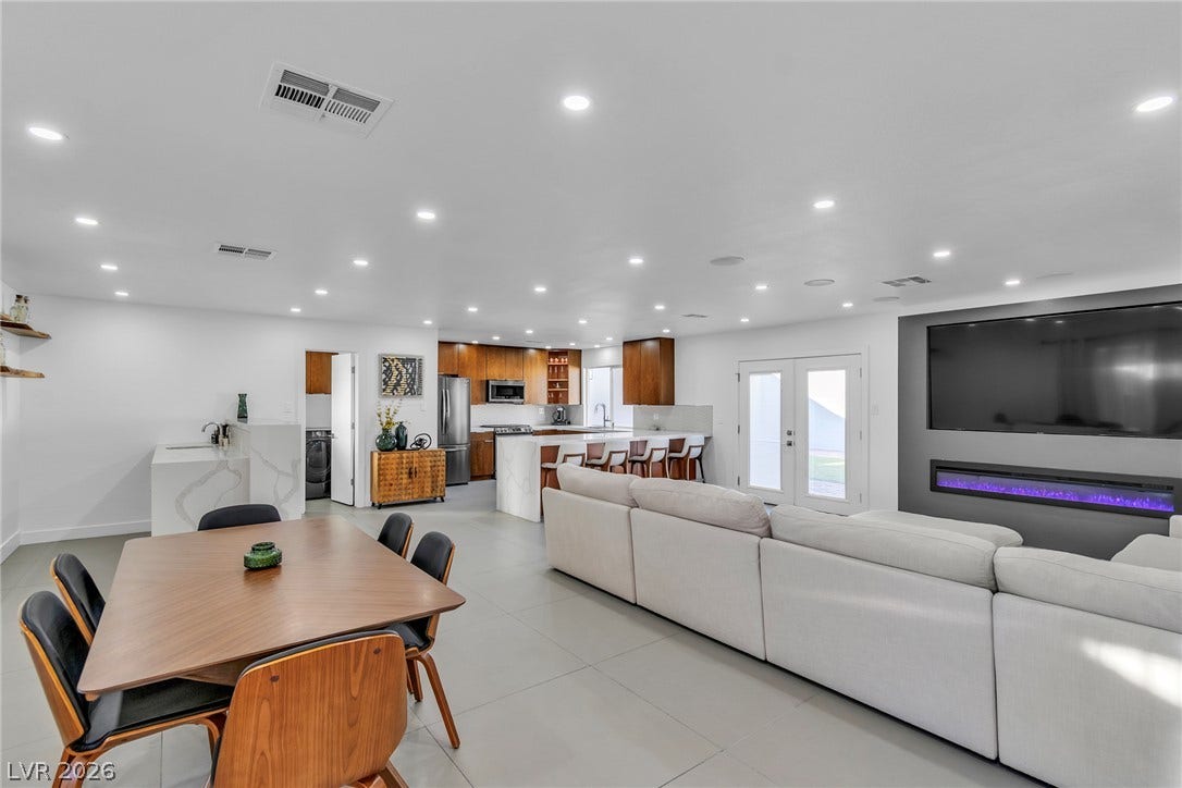 4170 Sheppard Drive, Las Vegas, NV 89121 An open floorplan seamlessly connects the dining area, kitchen, and living space.