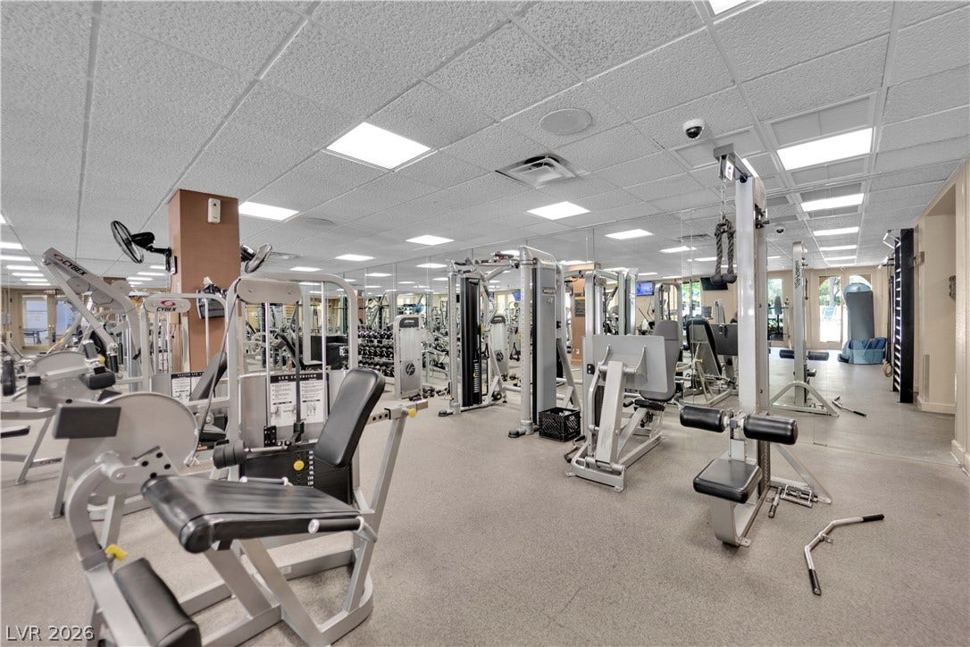 220 E Flamingo Road, #117, Las Vegas, NV 89169 An expansive community fitness center features drop ceiling panels and professional-grade workout equipment.