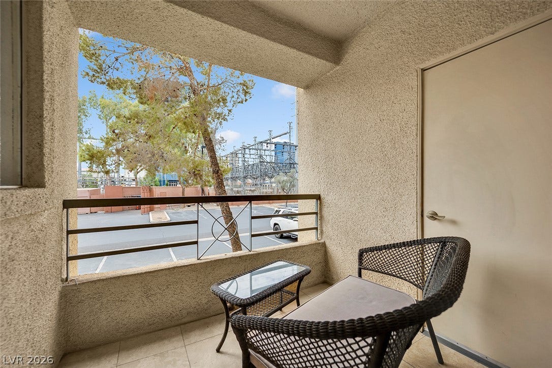 220 E Flamingo Road, #117, Las Vegas, NV 89169 A private covered balcony features durable tiled flooring and textured stucco walls.