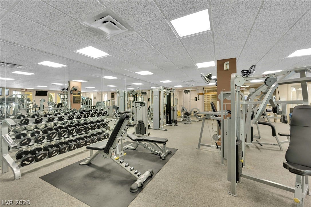 220 E Flamingo Road, #117, Las Vegas, NV 89169 A fully equipped fitness center features durable flooring and mirrored walls.