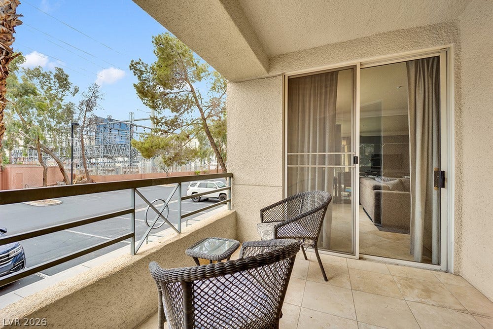 220 E Flamingo Road, #117, Las Vegas, NV 89169 A private covered balcony features tile flooring and sliding glass door access.