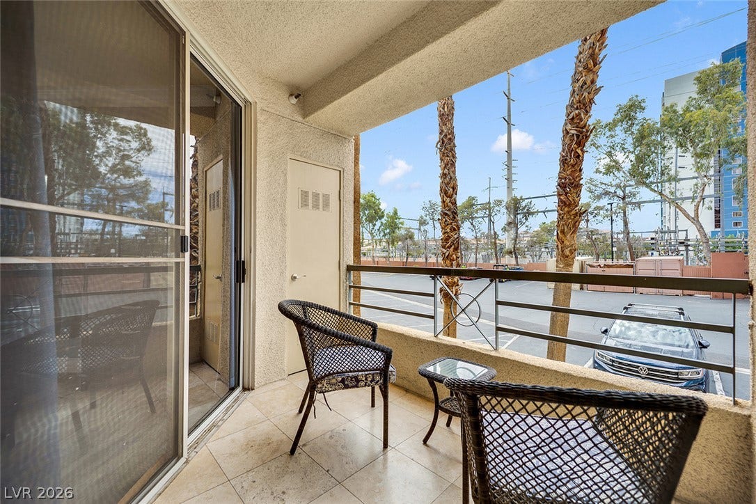 220 E Flamingo Road, #117, Las Vegas, NV 89169 A private covered balcony features tiled flooring and sliding glass doors.