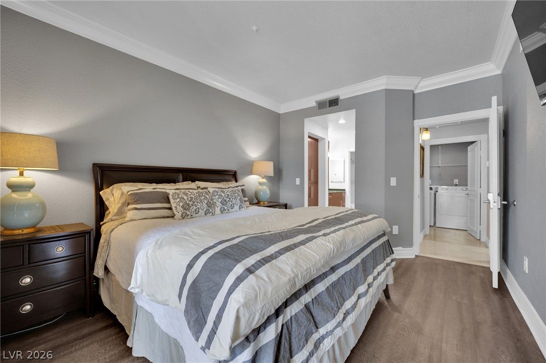 220 E Flamingo Road, #117, Las Vegas, NV 89169 Elegant crown molding complements the sleek wood flooring in this restful suite.
