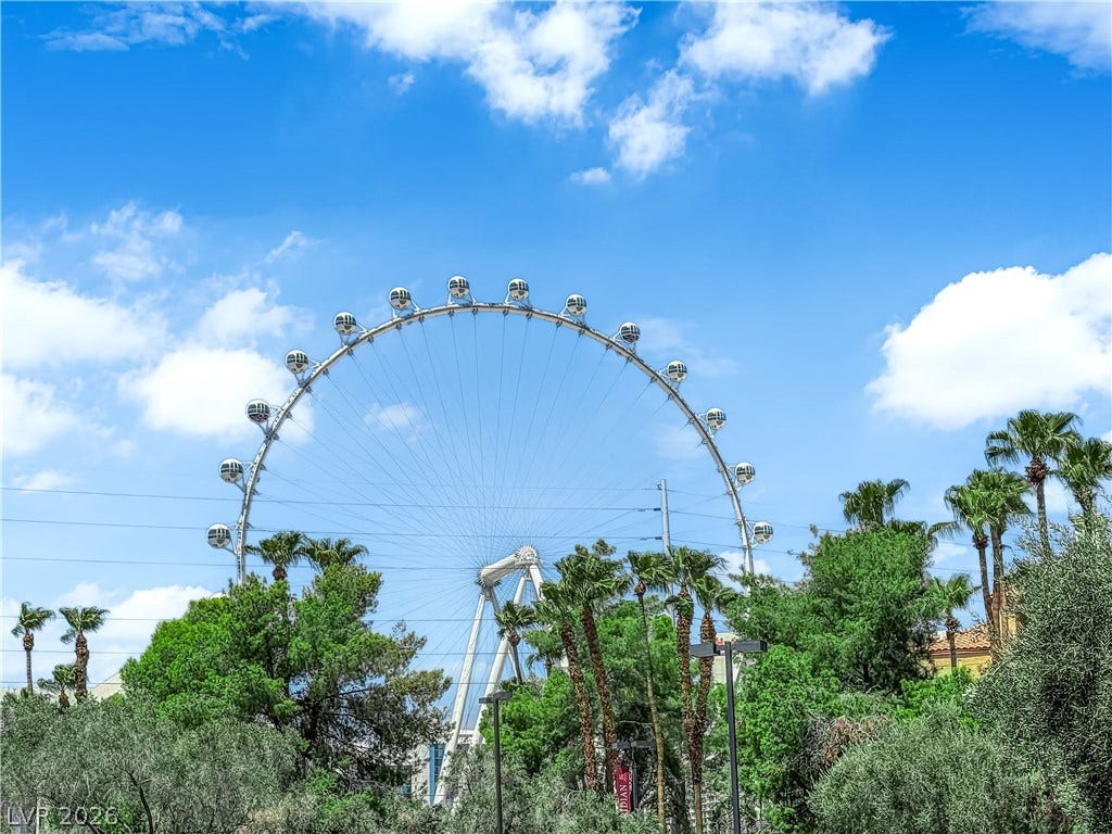220 E Flamingo Road, #117, Las Vegas, NV 89169 Lush tropical palm trees frame a spectacular view of the local observation wheel.