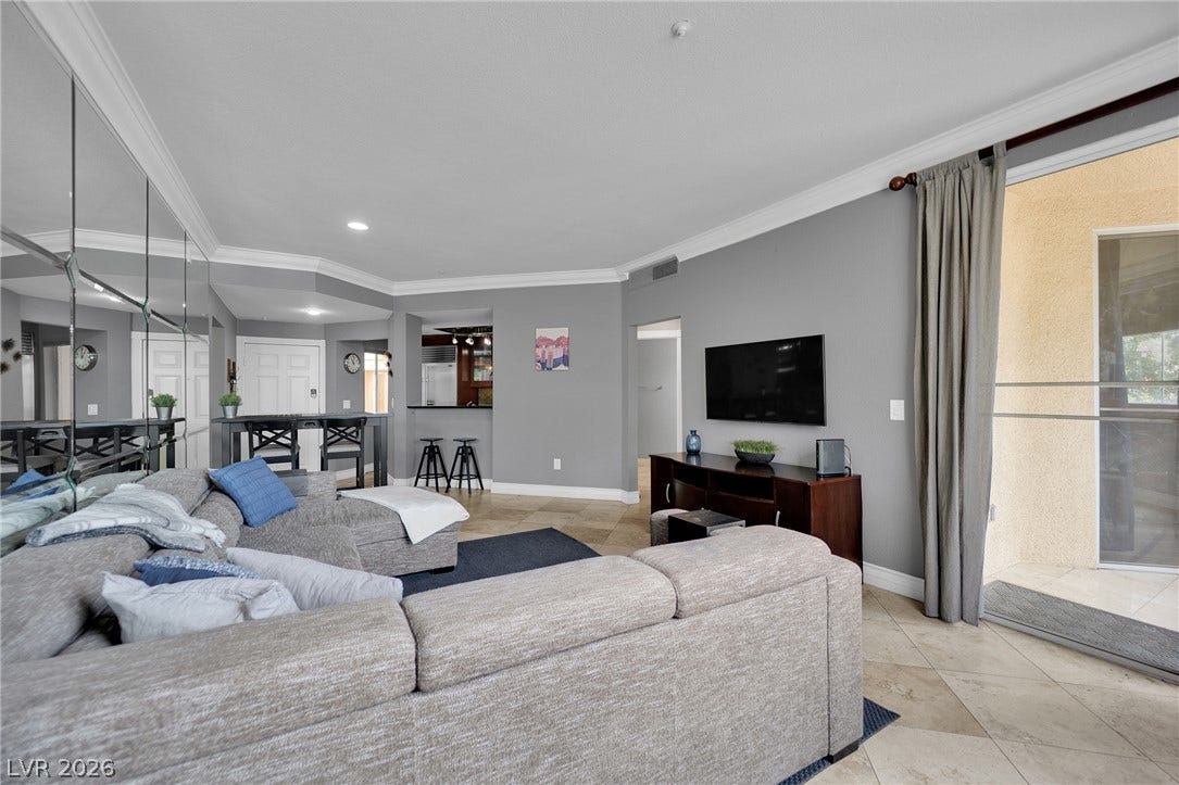 220 E Flamingo Road, #117, Las Vegas, NV 89169 An open floorplan with crown molding and tile flooring leads to a private balcony.